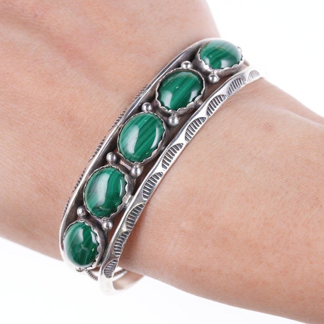 6.5" Vintage Larry Moses Yazzie Navajo Sterling and malachite bracelet approx 19mm wide. All precious metals are tested,...
