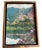 A charming Spanish oil on canvas depicting a peaceful countryside scene with a hillside chapel overlooking still waters...
