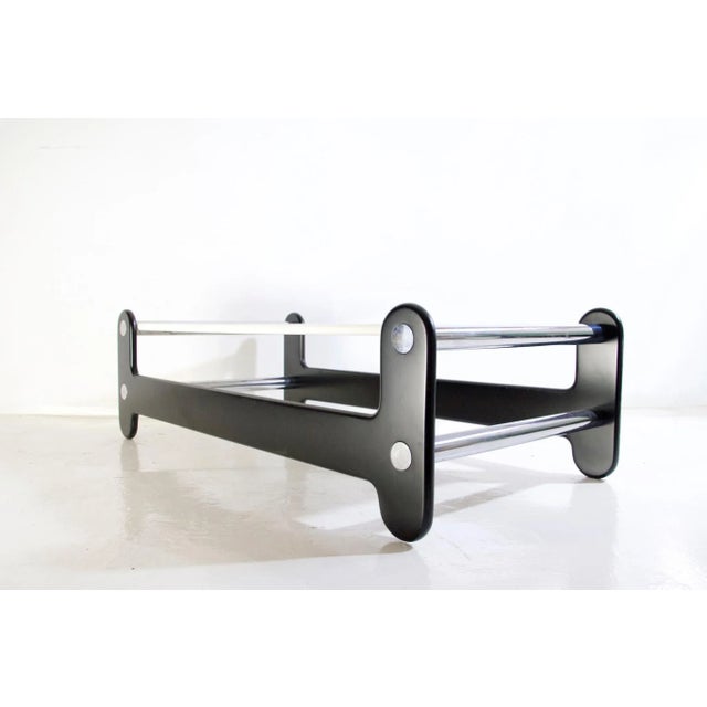 1970s rectangular black and white coffee table with chrome details in so called OP style representative of the era. The...