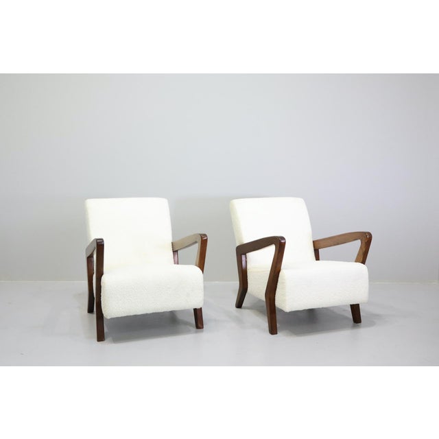 A rare and sophisticated pair of mid-century Italian armchairs from an important villa in Bologna. Designed by Gio Ponti,...
