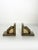 Pair of marble bookends, France, 1950s, with an elegant geometric design typical of the period's decorative style. Each...