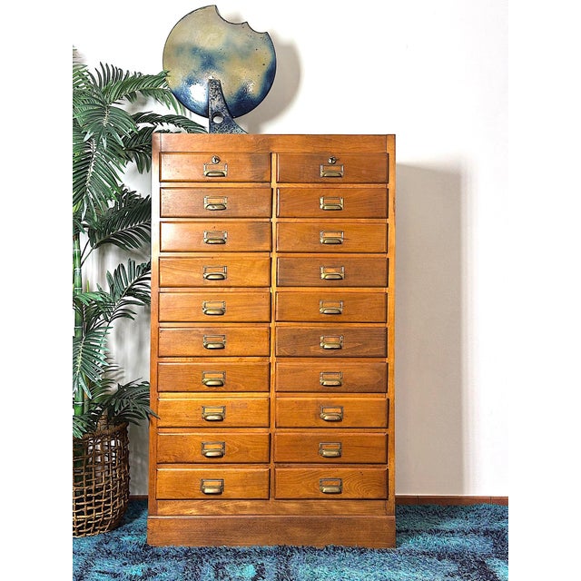 Vintage 1950s chest of drawers made in italy. The chest of drawers features a solid beech wood structure with a warm honey...