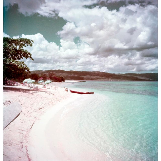 Jamaican Shoreline by Toni Frissell A man pulls his boat ashore onto a coastline in Jamaica. This personal work was done...