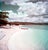 Jamaican Shoreline by Toni Frissell A man pulls his boat ashore onto a coastline in Jamaica. This personal work was done...
