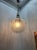 Mid-century chandelier pendant. Frosted and textured glass sphere and Brass Ornaments. by Italian lighting designer and...