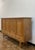 A very handsome highboard in oak with lovely carved details. Attributed to Henry Kjærnulf and likely made by EG Mobler in...