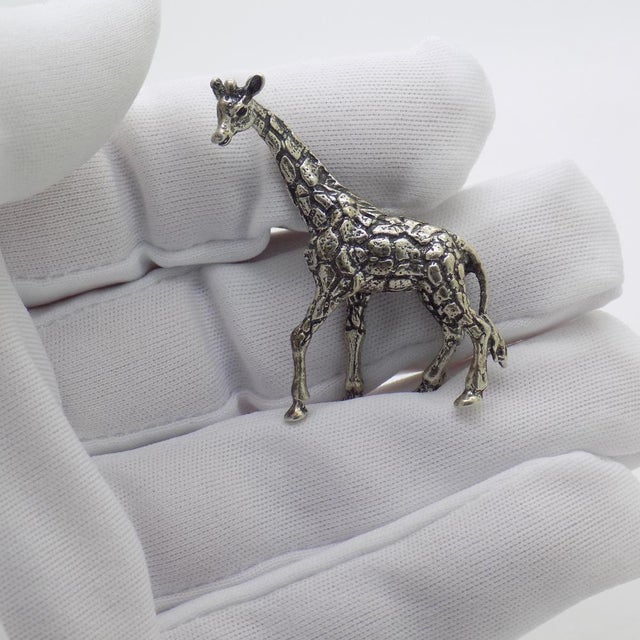 A vintage object depicting a miniature giraffe, crafted in Italy between the 1960s and 1970s in authentic continental...
