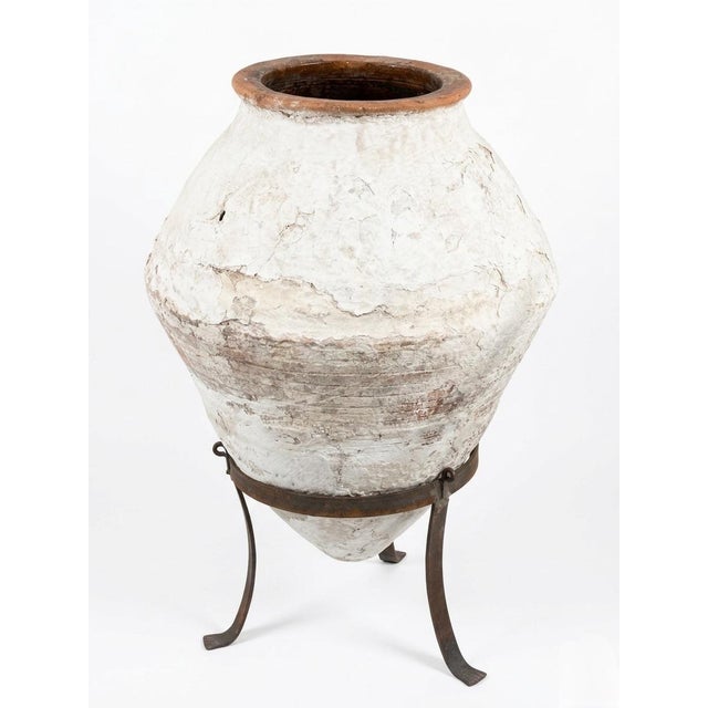 Add a touch of Mediterranean history to your space with this authentic Greek terracotta olive oil jar, dating back to...