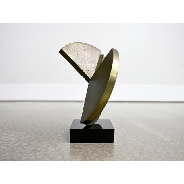 Vintage table top sculpture crafted in solid bronze affixed to a black lucite base. Body of sculpture features a thick...