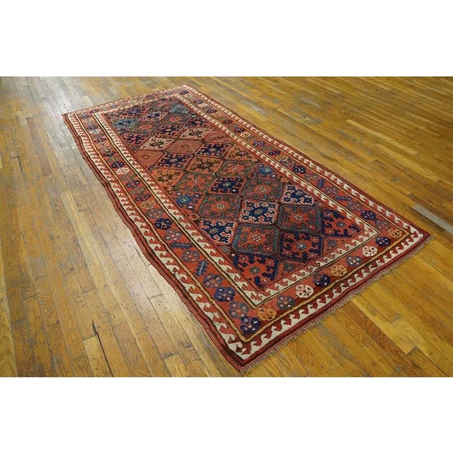 Antique Persian Kurdish Rug. Size: 4'2" x 8'10". A field pattern of colorful diamonds, each enclosing a cross with hooks...