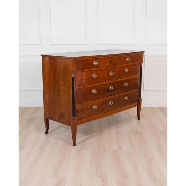 A refined Italian 18th century Directoire chest of drawers, beautifully crafted in warm cherrywood with elegant...