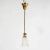 An antique hall light offers brass frame and shaft terminating in single light with frosted shade having etched floral...
