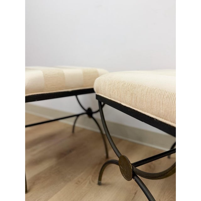 This pair of designer footstools in the style of furniture by Swain brings a tailored, sculptural presence to any seating...