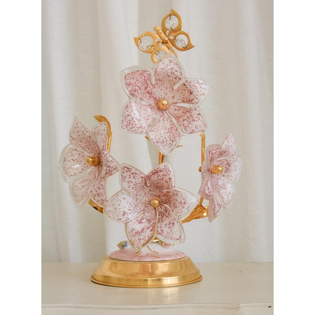 Offered here is one exquisite vintage Italian table lamp featuring handblown Murano glass flowers in soft pink and white....