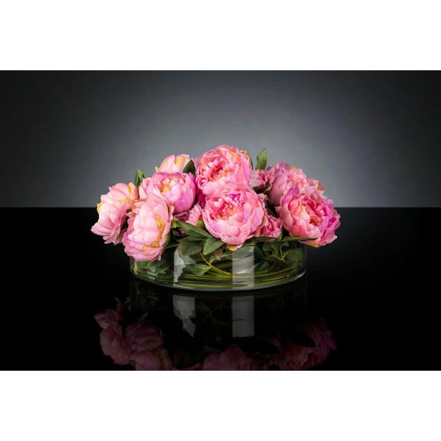 A vase with a flower arrangement.