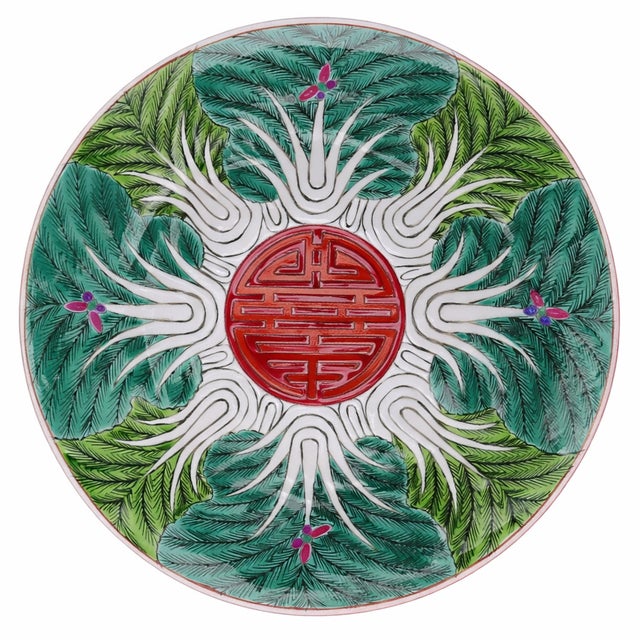 This Bok Choy porcelain plate captures the artistry and symbolism of Jingdezhen, China, where fine Famille Verte porcelain...