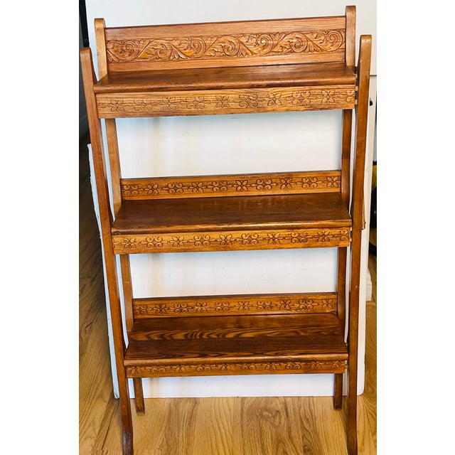 Antique American handcarved in oak wood Arts and Crafts shelving rack etagere folding.