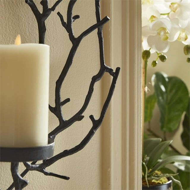 The Branch Wall Candleholder This clever circular branch wall candleholder is rich with drama in a matte black. Made of a...