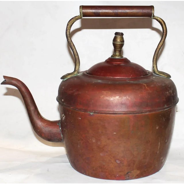 Very old copper tea kettle, hand hammered, middle seamed, gooseneck spout, brass lid stem and handle mounts. Persian or...