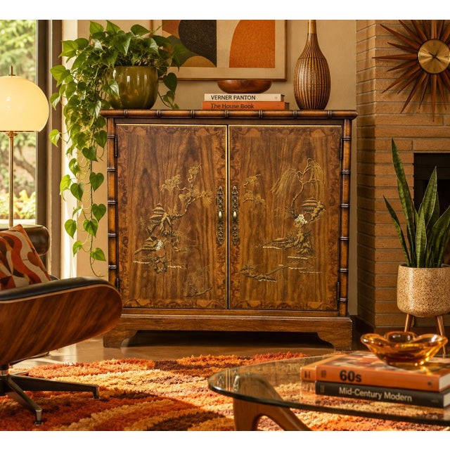 Vintage 1970s Drexel Asian cabinet. The charming design features a hand painted Oriental edifice. The facade is further...