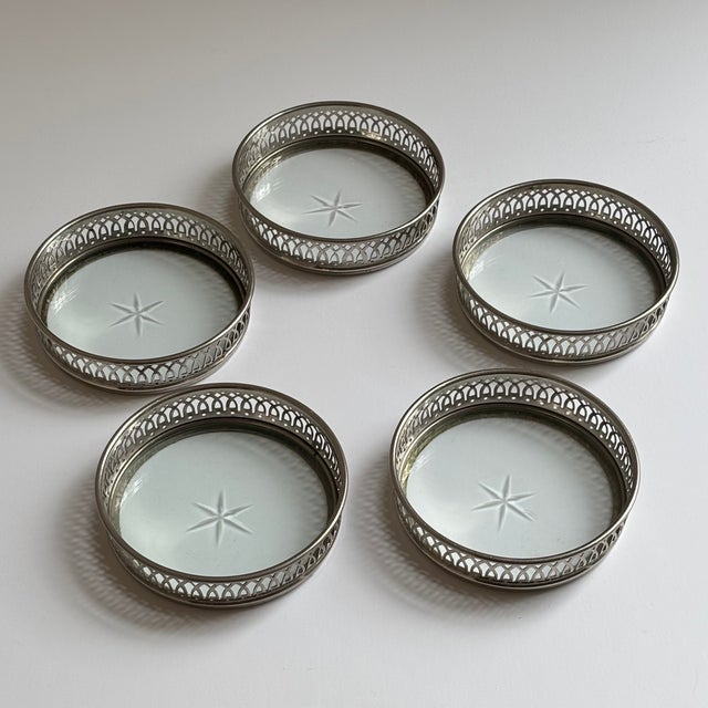 Elevate your bar cart or cocktail table with this elegant set of five vintage silver-plated gallery coasters. Each coaster...