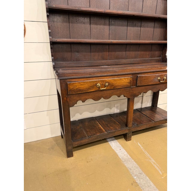 A superb quality and highly attractive 18th Century Welsh oak potboard dresser. This exceptional piece is constructed from...
