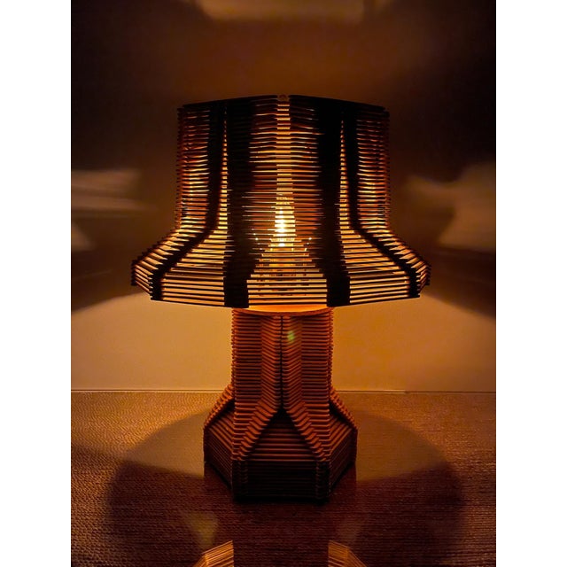 A striking vintage Mid-Century handcrafted sculptural table lamp inspired by the timeless artistry of traditional tramp...