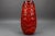 Vibrant 1970s bay keramik “fat lava” vase, west germany, featuring a bold red glaze with textured floral relief. A...
