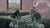 In "Corner of Your Lovesong," a serene figure reclines on a plush green sofa, surrounded by a field of dandelions that...