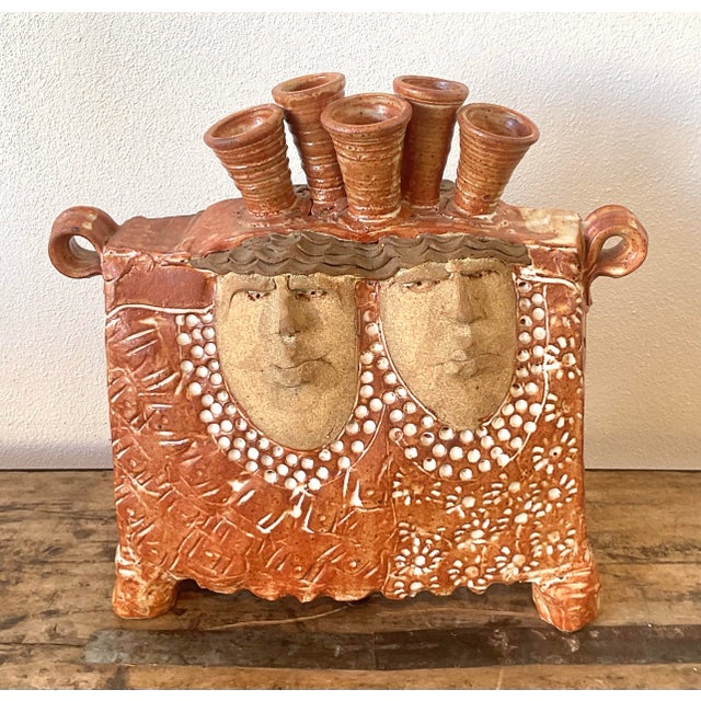 This exceptional vintage studio art pottery vessel is a captivating fusion of sculpture and functionality. Hand-built from...