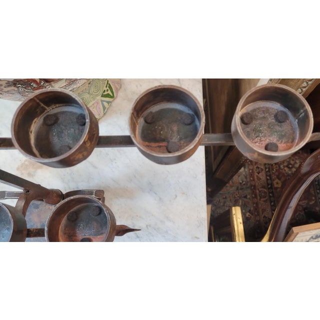 Original hand forged wrought iron candl holder by Jan Barboglio. Features hand forged wrought iron construction forming a...