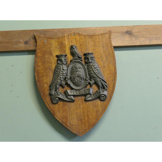 Wall plaque mounted with bronze coat of arms of the city of leeds the bronze is set on a fine walnut shield it is 18”...