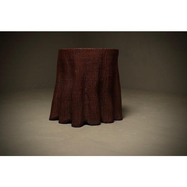 Highly sculptural wicker side table or stand from the 1970s. Often referred to as a "Ghost Drapery" design due to its...