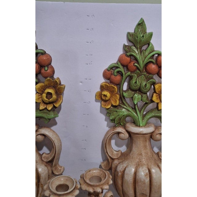 Matching pair of vintage HOMCO wall sconces (mold 4104) in a fluted urn design with a cream and ivory finish, topped with...