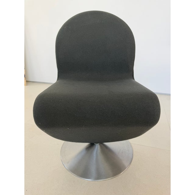 Set of 8 Verner Panton Dining Swivel Chairs. Fabric is a graphite gray. 5 chairs have some bubbling of the fabric.