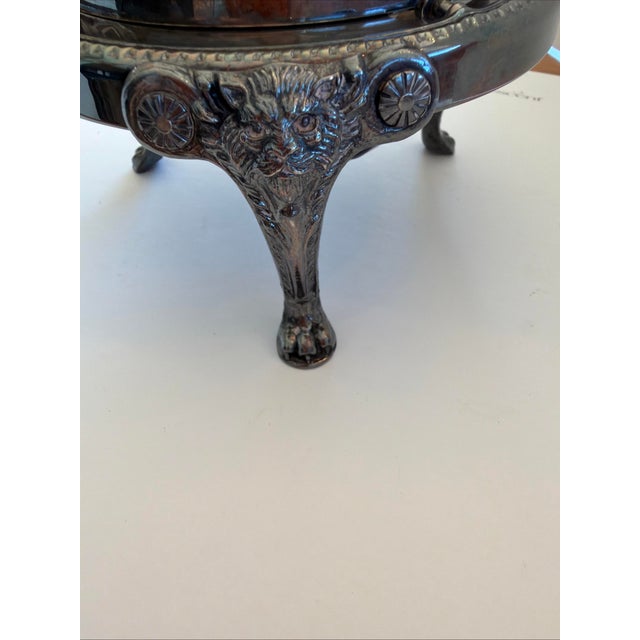 The product is a vintage 1883 FB Rogers Silver Co 273 roll top caviar/butter dish with a lion head design and insert. Made...