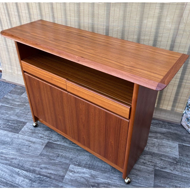 Vintage Mid-Century Scandinavian Modern Style Teak Server with Casters by Nordic Furniture of Ontario, Canada. Circa 1980s...