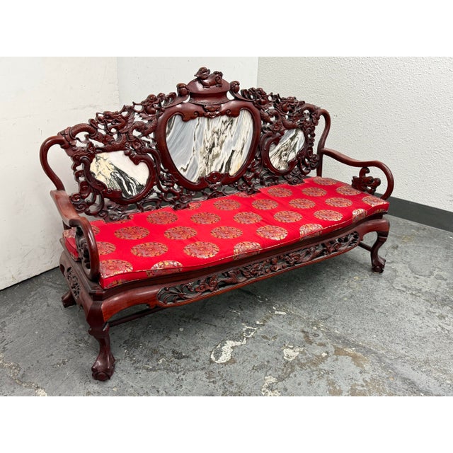 Design Plus Gallery presents a Qing Dynasty Style Carved Rosewood with Marble Back Rest Settee. The sofa is ornately...