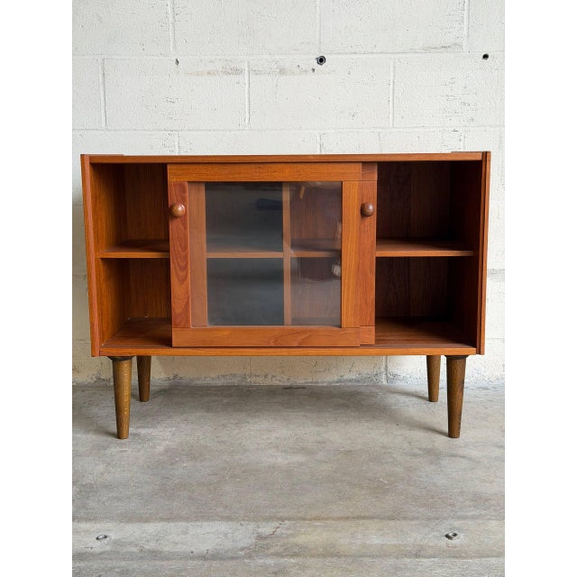 This low-profile piece brings functional minimalism to your interior, capturing the classic appeal of vintage Danish Mid-...