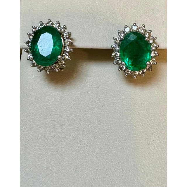 Approximately 4 Carat Oval Shape Natural Emerald Each or 8 ct total Emerald & Diamond Post Back Earrings 14 Karat White...