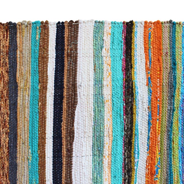 Bright and colorful striped Sari rug made from recycled cotton fabrics repurposed into fun striped rugs. Colors vary and...