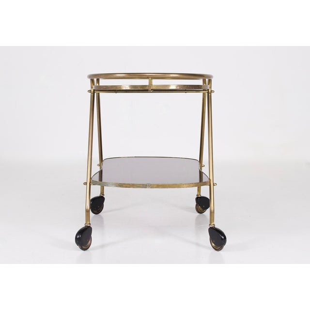 Two-tone brass and formica trolley, ilse möbeln editions, 1960s. L 78 cm x d 45 cm x h 62 cm. Height between the two...