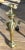 Offering an attractive set of brass andirons featuring a shell embossed emblem and detailed ball and claw feet.