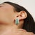 These refined bar earrings are crafted in 925 sterling silver and showcase natural round green onyx gemstones measuring 2...