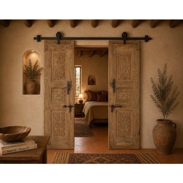 Antique Indian carved teakwood door, c. 1880–1900, carefully bleached to highlight its sculptural carvings and lighten the...