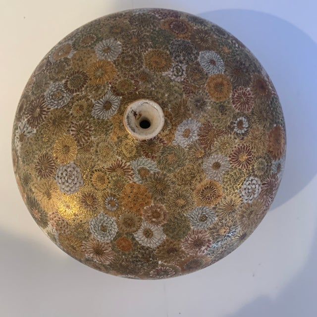 This elegant, bulbous vase stands on a small base and was probably designed for ikebana ( a Japanese flower arranging. The...