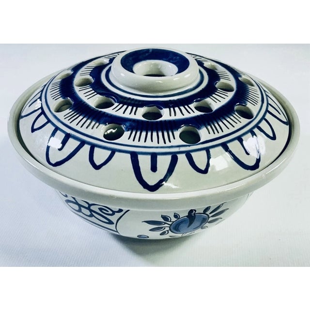 Add a touch of classic elegance to your collection with this **Vintage Delft Williamsburg Restoration Porcelain Flower...