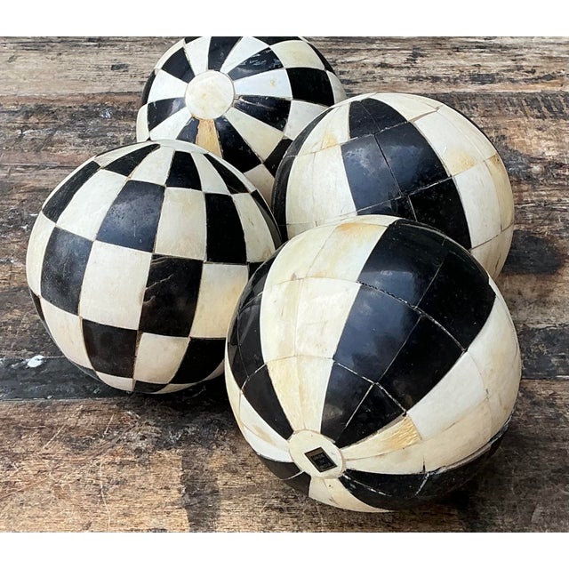 This striking set of four vintage tessellated spheres is a masterclass in geometric precision and artisanal craftsmanship....
