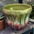 This vintage Majolica jardinière planter features a high-relief Art Nouveau floral pattern in magenta and green colors....