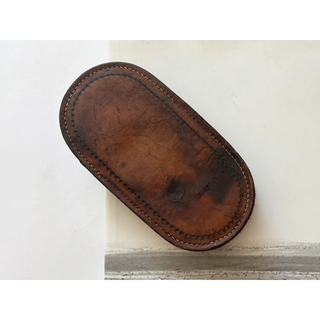 Here is an antique leather horse curry brush, stamped “Army.” This piece of history is a perfect gift for an equestrian,...